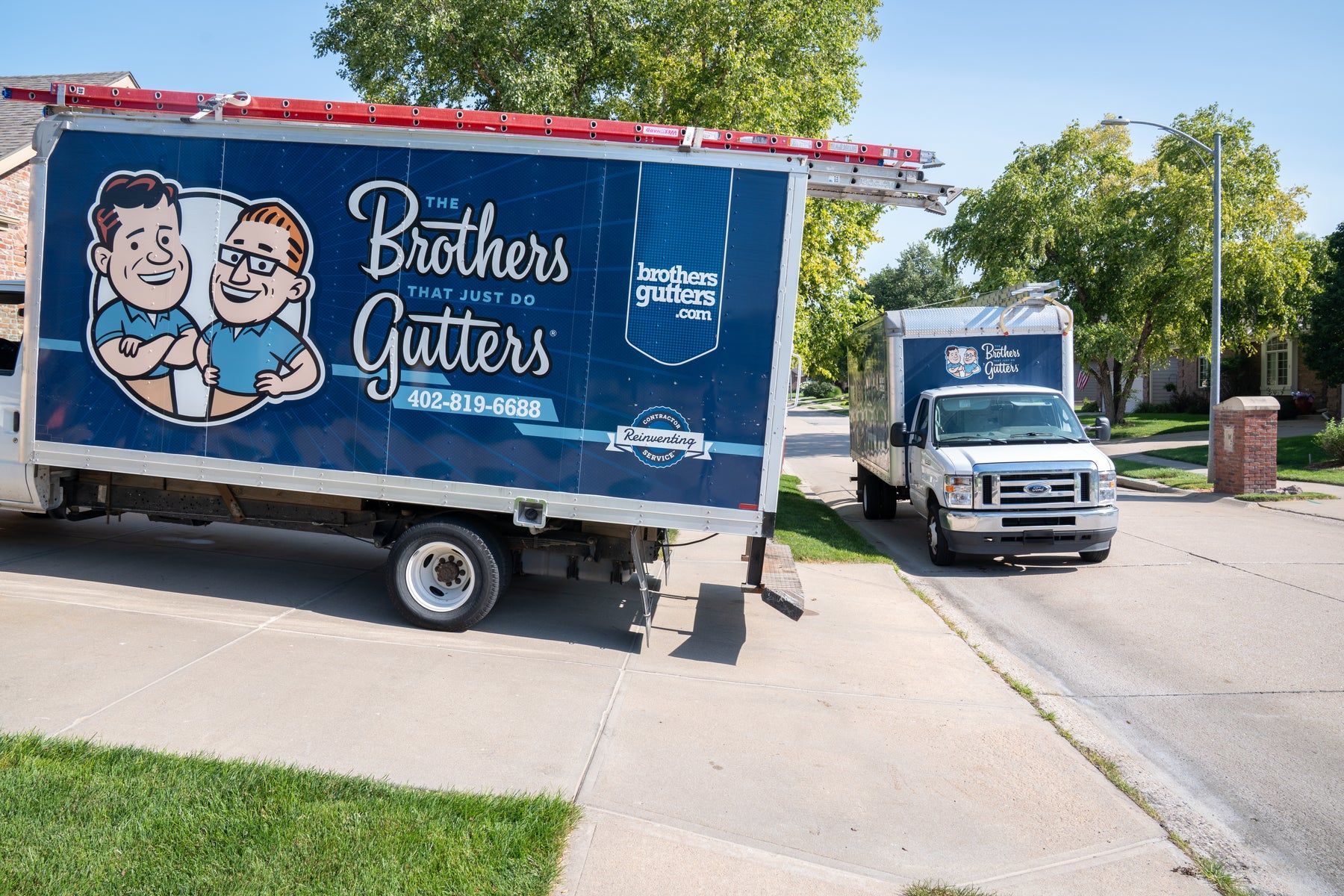 Brothers Gutters box truck parked on a residential street