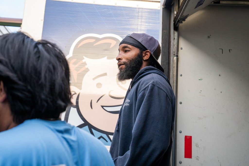 Crew members talking at the truck