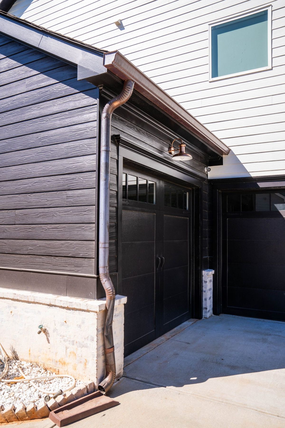 Downspout at the corner of a modern garage