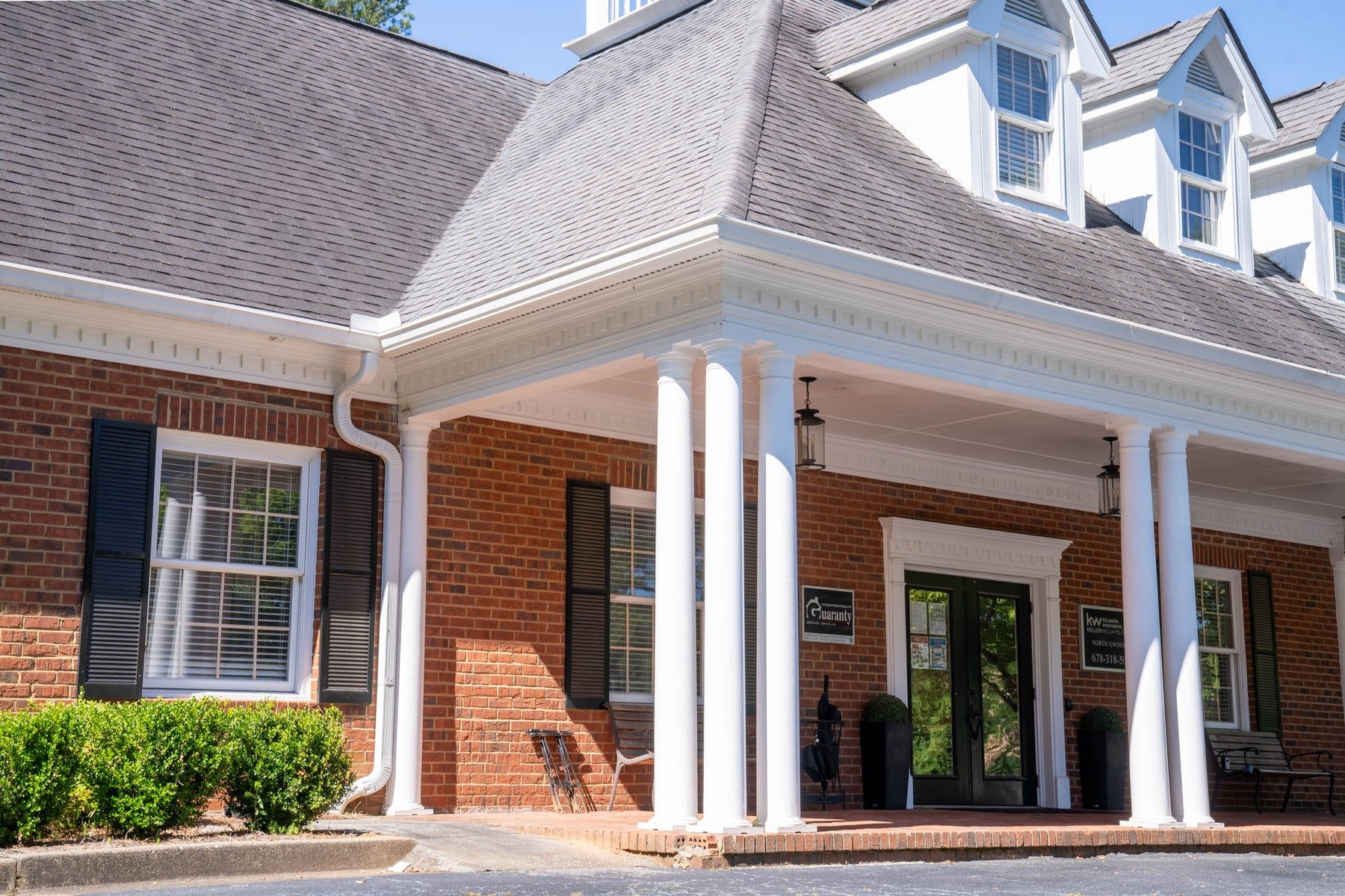 White gutters at a commercial office entrance